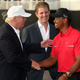 Donald Trump greets Tiger Woods after the final round of the World Golf Championships-Cadillac Championship as Eric Trump looks on at the Trump Doral Golf Resort & Spa on March 10, 2013, in Doral, Fla. (Warren Little/Getty Images)